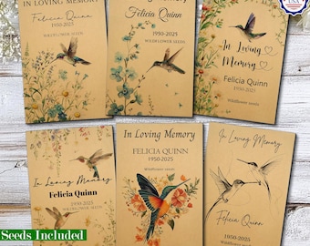 May include: Six rectangular kraft paper packets labeled In Loving Memory, Felicia Quinn, 1950-2025, and Wildflower Seeds. Each packet features botanical illustrations of wildflowers and hummingbirds in various artistic styles and color palettes.