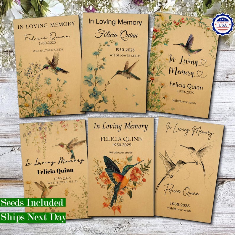 May include: Six rectangular kraft paper packets labelled In Loving Memory, Felicia Quinn, 1950-2025, and Wildflower Seeds. Each packet features botanical illustrations of wildflowers and hummingbirds in various artistic styles and colour palettes.