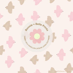 May include: A seamless pattern with repeating illustrations of stylized birds in pink and beige on a cream background. The design includes a central circular graphic with the text "Bonnie + Belle Prints" and a flower illustration. The pattern is for fabric.