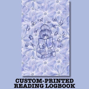 May include: Custom-printed reading logbook with a floral background of light purple flowers. A line drawing of a person reading a book, surrounded by butterflies, is featured on the cover. The person is holding a mug.