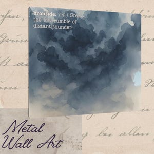 May include: Metal wall art featuring a watercolor-style depiction of dark blue clouds. The artwork includes the definition of "brontide" in white text: the low rumble of distant thunder. The background has a vintage paper texture.