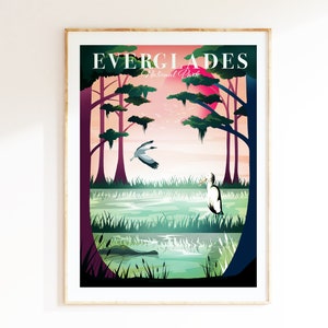 May include: A framed art print featuring a stylized Everglades National Park landscape. The artwork depicts a swamp scene with trees, birds, and an alligator, under a pink sun. The text "EVERGLADES National Park" is at the top.