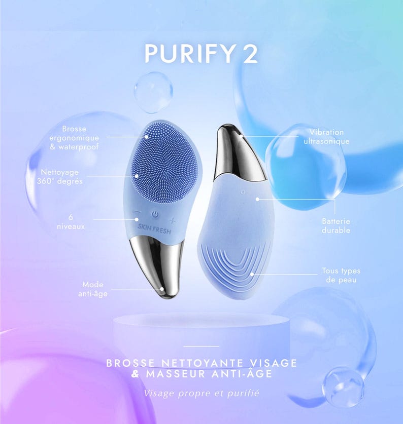 May include: Two light blue facial cleansing brushes with silver accents are displayed against a blue background. The text "PURIFY 2" is at the top. One brush has a textured surface and the other has a smooth surface. The text "SKIN FRESH" is visible on one brush.