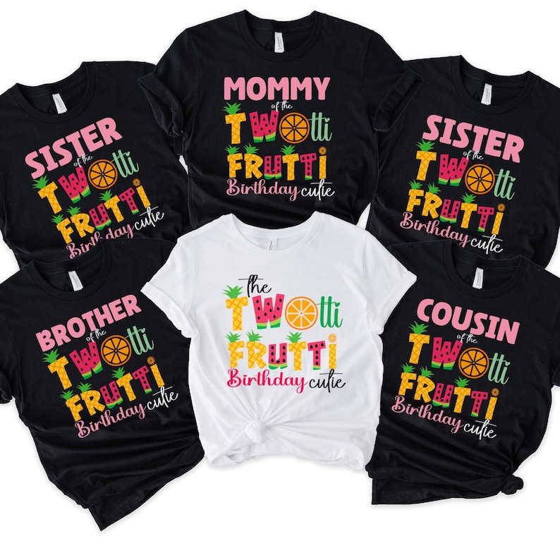 a bunch of shirts that are on a table