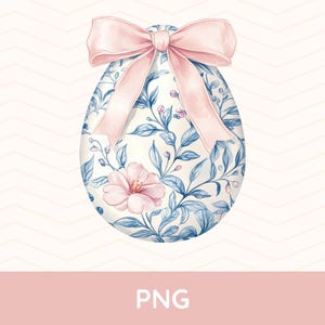 Peut inclure: Un œuf de Pâques blanc avec un motif floral bleu et rose et un nœud rose.