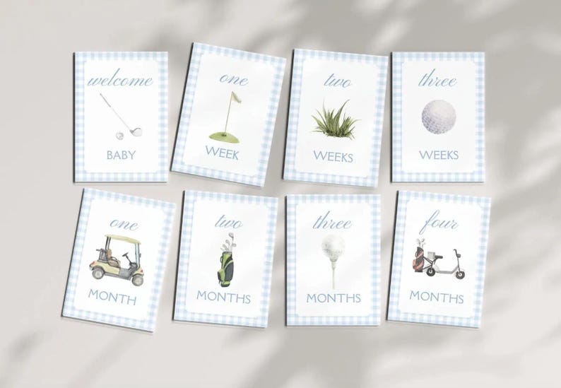 May include: Eight blue and white gingham cards with golf-themed illustrations and text. The cards read "welcome baby", "one week", "two weeks", "three weeks", "one month", "two months", "three months", and "four months".