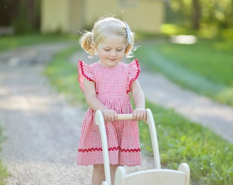 Red Gingham Pinafore Dress or Jumper with flutter sleeves.   Made to order in sizes 2, 3, 4, and 5.  Trimmed in red rick rack.
