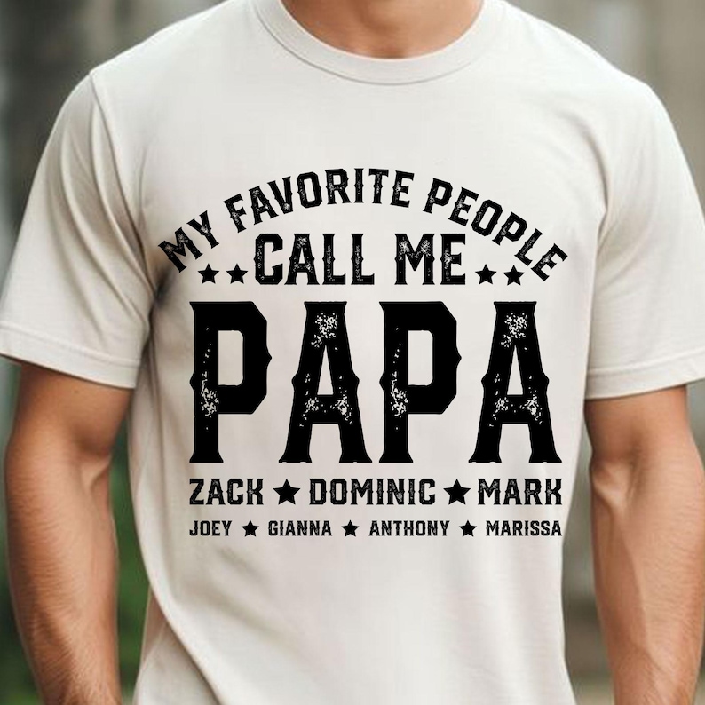 May include: White t-shirt with black text that reads "My Favourite People Call Me Papa Zack Dominic Mark Joey Gianna Anthony Marissa".
