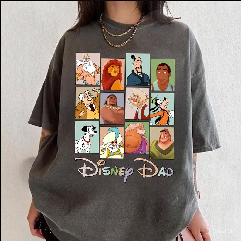 May include: A gray t-shirt with a graphic of various Disney characters in squares. The text "Disney Dad" is printed below the graphic.