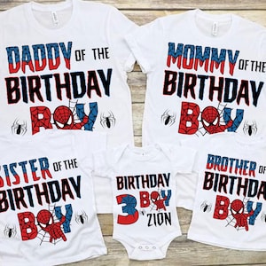 May include: Set of five white t-shirts with red, blue, and black Spiderman themed graphics. The shirts say "Daddy of the Birthday Boy", "Mommy of the Birthday Boy", "Sister of the Birthday Boy", "Brother of the Birthday Boy", and "Birthday Boy 3 Zion".