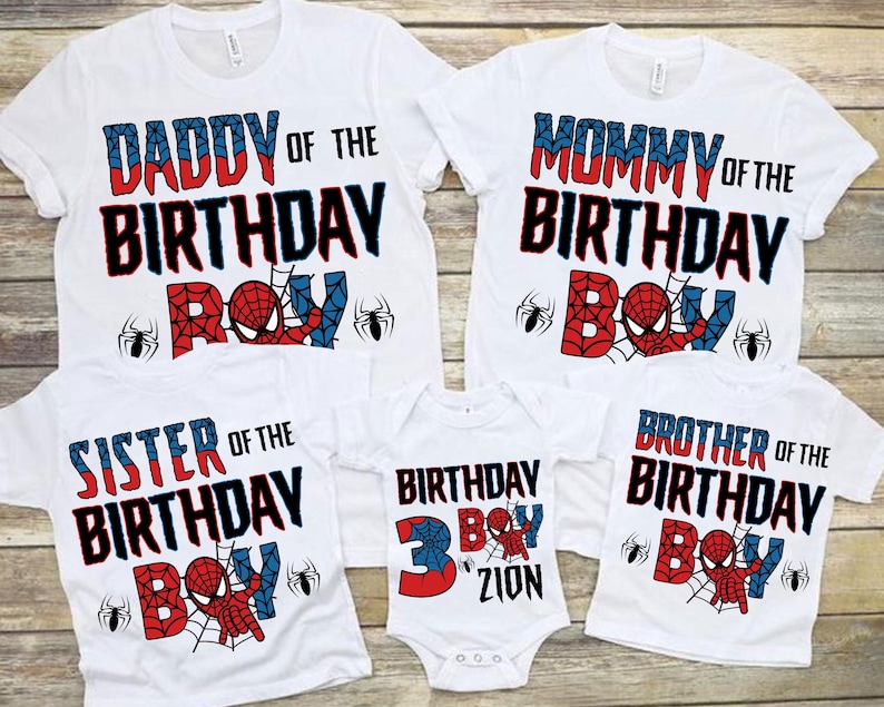 May include: Set of five white t-shirts with red, blue, and black Spiderman themed graphics. The shirts say "Daddy of the Birthday Boy", "Mommy of the Birthday Boy", "Sister of the Birthday Boy", "Brother of the Birthday Boy", and "Birthday Boy 3 Zion".