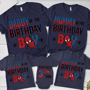 May include: A set of four navy blue t-shirts with a Spiderman theme. The shirts say "Daddy of the Birthday Boy", "Mommy of the Birthday Boy", "Sister of the Birthday Boy", and "Brother of the Birthday Boy".