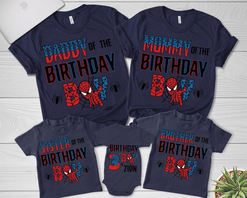May include: A set of four navy blue t-shirts with a Spiderman theme. The shirts say "Daddy of the Birthday Boy", "Mommy of the Birthday Boy", "Sister of the Birthday Boy", and "Brother of the Birthday Boy".