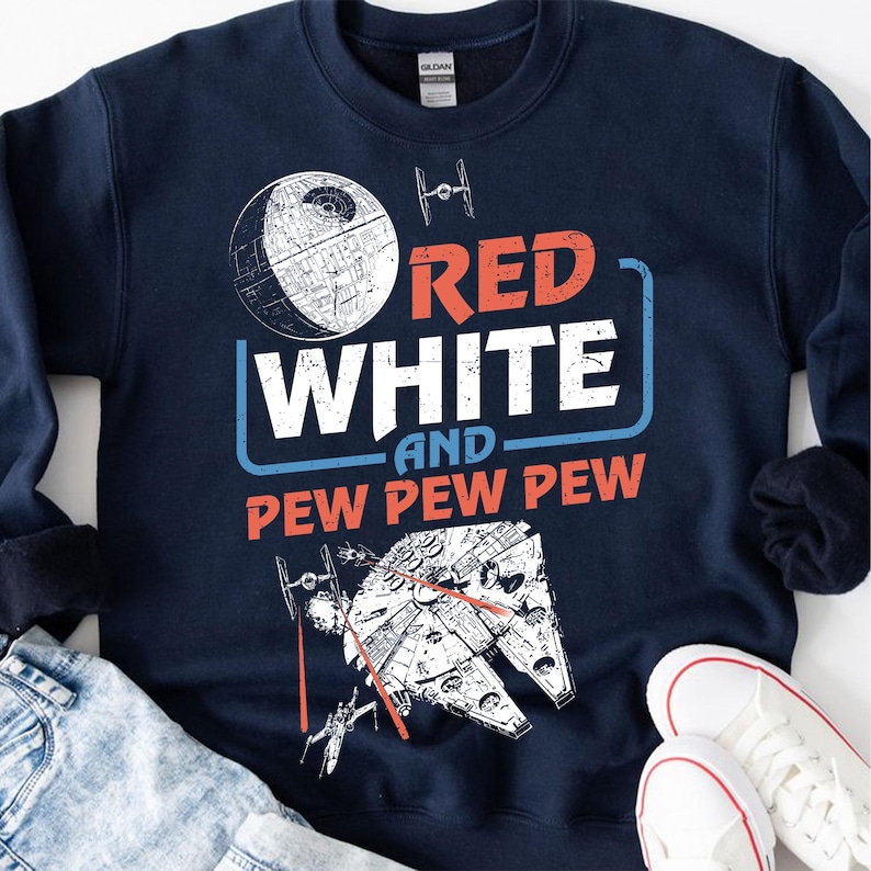 May include: Navy blue sweatshirt with a white and red graphic design. The graphic features a Death Star, a starfighter, and the text "Red White and Pew Pew Pew".