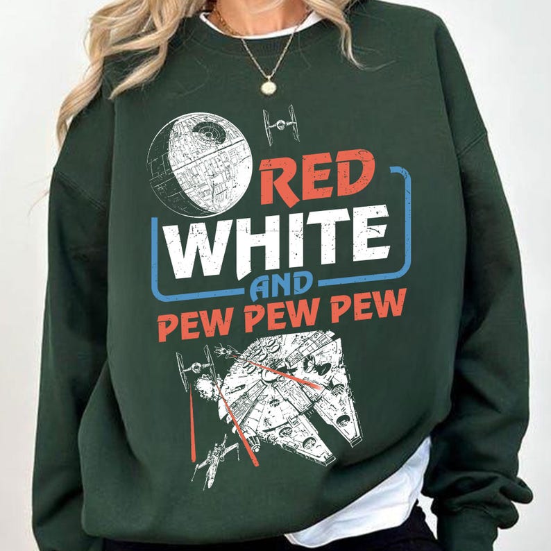 May include: Green sweatshirt with a white and red graphic print that says "Red White and Pew Pew Pew". The graphic also includes a star wars inspired spaceship and a Death Star.