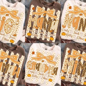 May include: A collection of six sweatshirts in white and brown, each featuring a large orange plaid bow, autumn leaves, and pumpkins. The designs display names like Gigi, Mama, Nana, Mamaw, Grandma, and Mimi, with smaller names listed below.