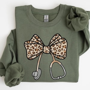 Nurse Leopard Bow Sweatshirt, Stethoscope Bow Shirt, Nurse Coquette Shirt, Gift for Nurse, Healthcare Shirt, Nurse Appreciation