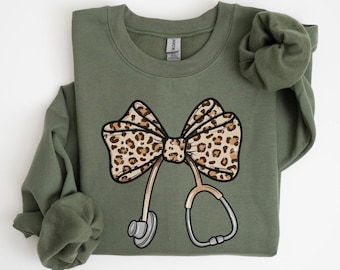 Nurse Leopard Bow Sweatshirt, Stethoscope Bow Shirt, Nurse Coquette Shirt, Gift for Nurse, Healthcare Shirt, Nurse Appreciation
