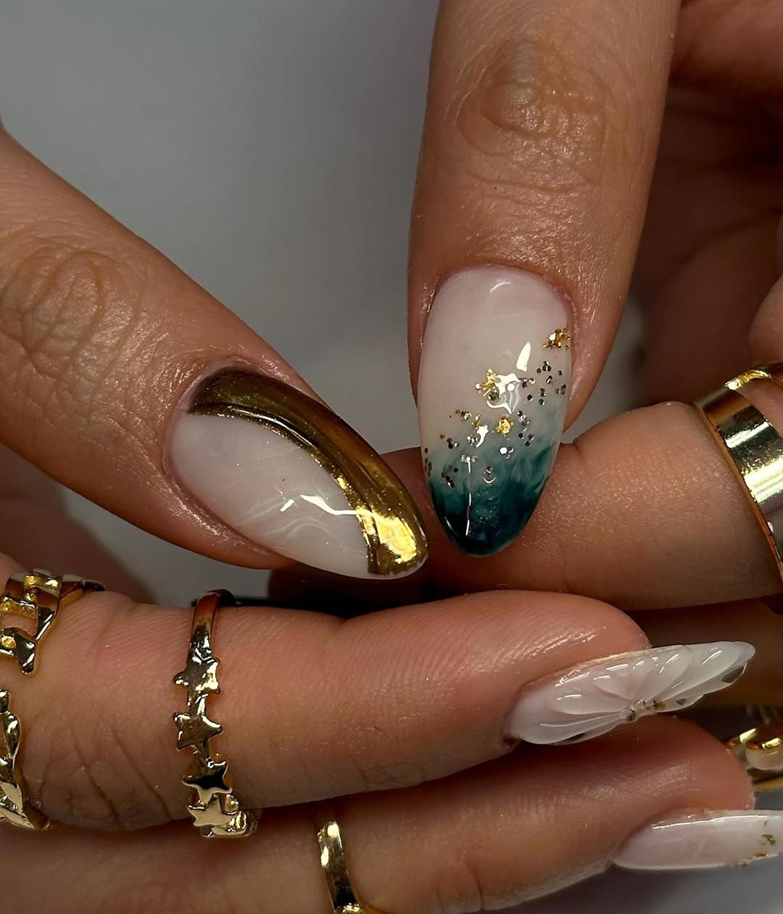 Elegant Gold Marble Nails That Shine