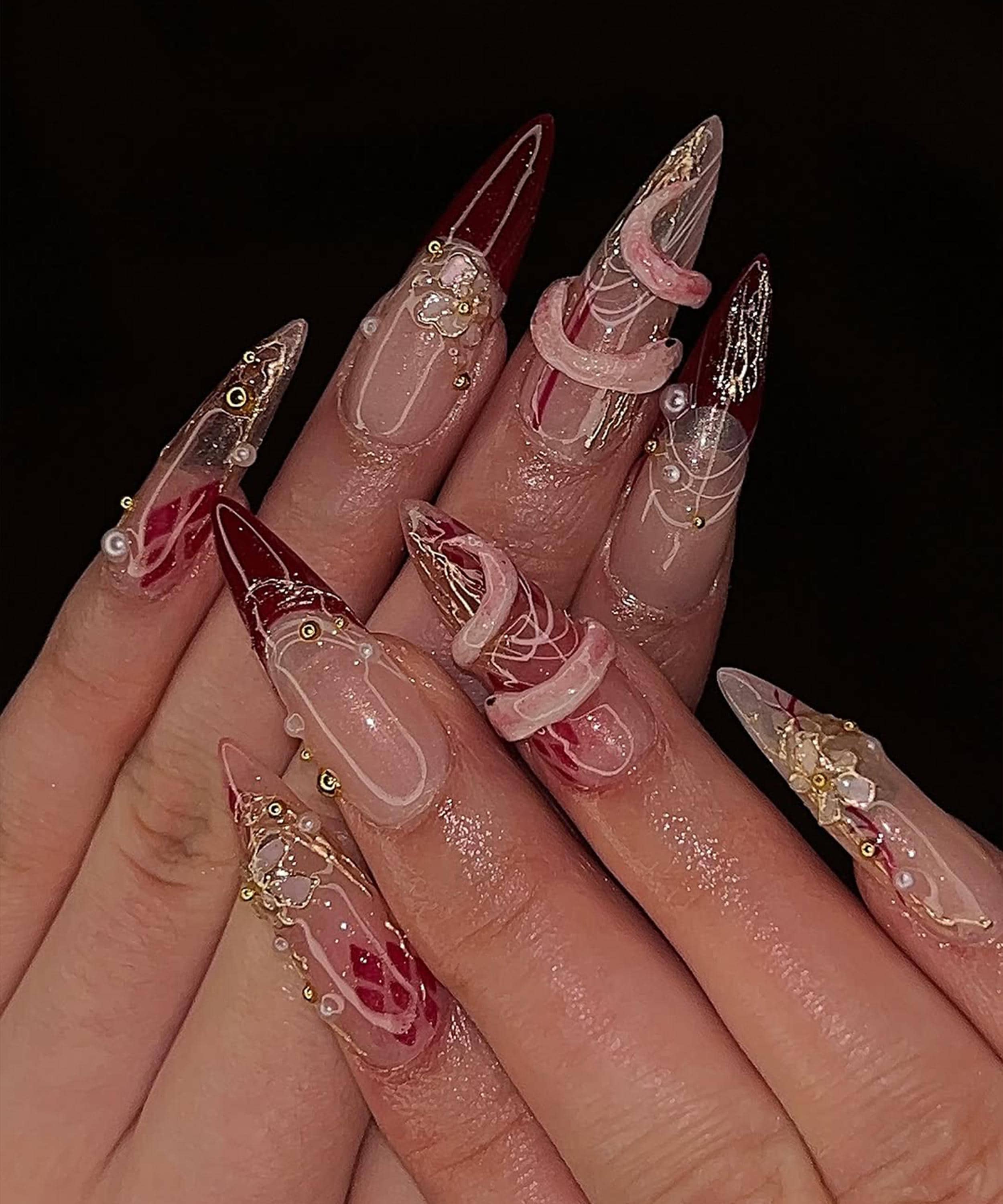 Elegant Clear Nail Designs with Red Gold Flair