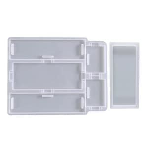 May include: A white silicone mold for making resin crafts. The mold has three rectangular sections and a separate rectangular mold for a smaller piece.