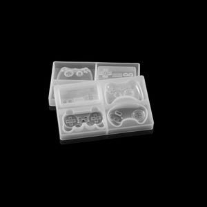 May include: A clear silicone mould tray featuring multiple recessed cavities shaped like various video game controllers and handheld consoles. The flexible, translucent material displays detailed impressions of buttons, directional pads, and joysticks.