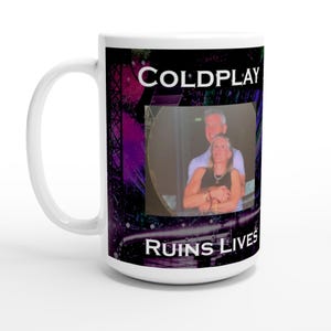 May include: White ceramic mug with a black and purple graphic. The mug features the band name "COLDPLAY" at the top and the phrase "RUINS LIVES" at the bottom. A photo of two people is in the center of the mug.
