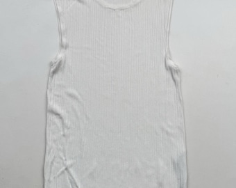 May include: A white sleeveless ribbed knit tank top.