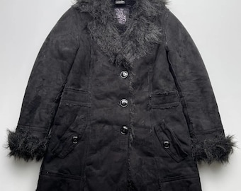 May include: Black faux fur-trimmed suede coat with a button closure and two pockets. The coat has a frayed hem and cuffs.