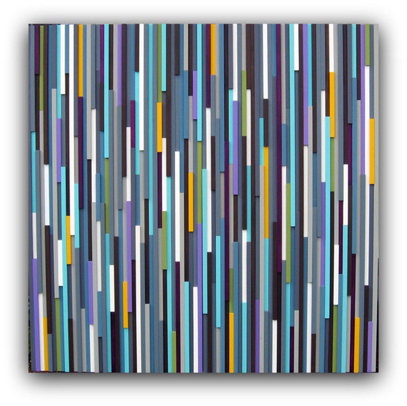 May include: Abstract wall art made of wood with vertical stripes in shades of blue, purple, grey, white, yellow, and green.