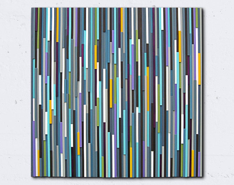 May include: Abstract wall art made of wood with vertical stripes in shades of blue, grey, white, purple, yellow, and green.