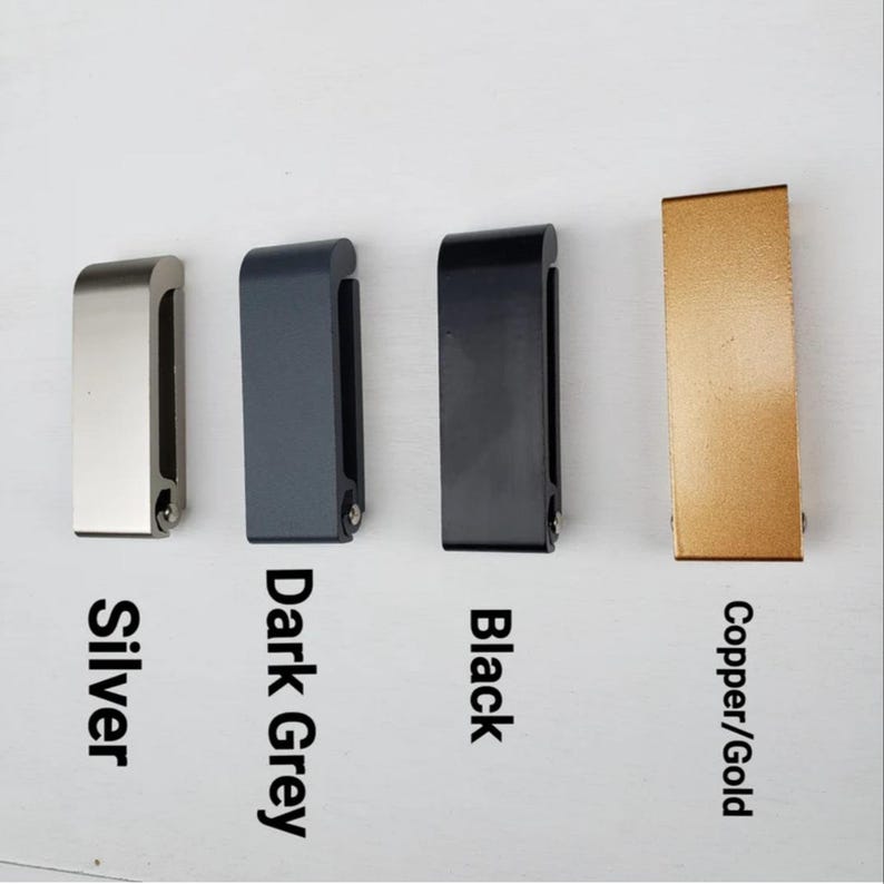May include: Four metal door handles in different finishes: silver, dark grey, black, and copper/gold.