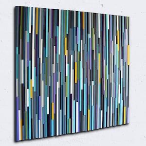 May include: Abstract wall art made of wood with vertical strips of various colours, including blue, teal, purple, yellow, and grey.