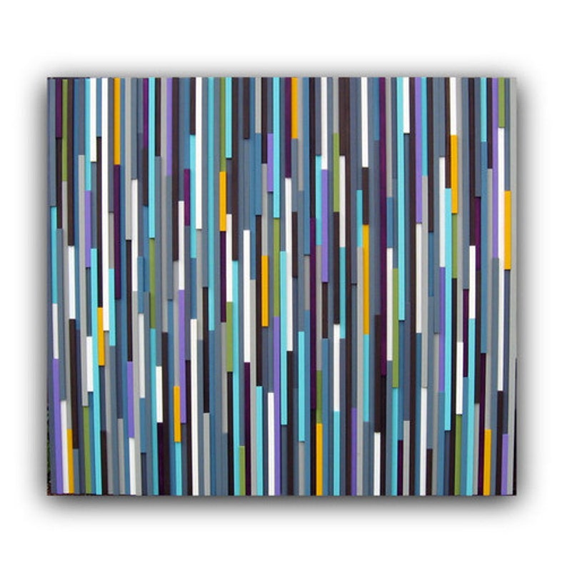 May include: Abstract wall art made of wood with vertical stripes in shades of blue, purple, grey, white, yellow, and green.