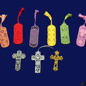 May include: A set of ten colorful bookmarks with intricate lace designs. The bookmarks are shaped like rectangles and feature a variety of patterns, including floral, geometric, and abstract designs. The bookmarks are all made of a delicate, lightweight material and have a tassel at the top.