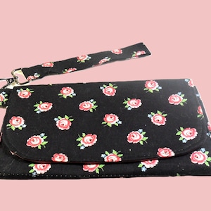 Cartera de mano con diseño floral