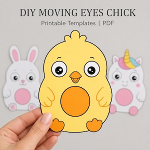 May include: Yellow chick-shaped printable template with black eyes and an orange belly, held by a hand. The text "DIY MOVING EYES CHICK" and "Printable Templates | PDF" are at the top. A white bunny and a unicorn are in the background.