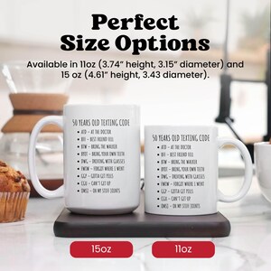 two coffee mugs sitting on top of a table