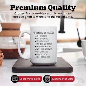 a white coffee mug sitting on top of a counter