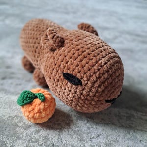 Crochet Capybara Plush – Handmade Amigurumi Capybara Toy with Orange – Soft Stuffed Animal – Cute Gift for Kids and Animal Lovers