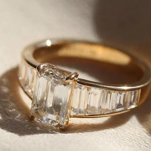 Emerald Cut Moissanite Engagement Ring: Baguette Channel Set, Four Claw Prong