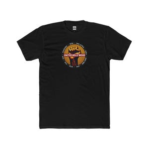May include: Black t-shirt featuring a graphic of a raised fist and the text "UNITED HOLLYWOOD" in a red banner. The graphic is surrounded by a circle of text listing various unions.