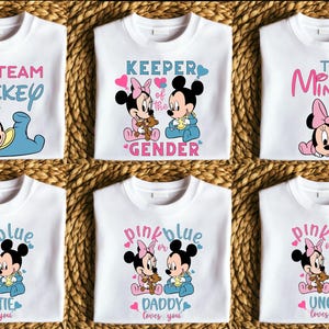 May include: Six white t-shirts with different designs featuring Mickey and Minnie Mouse. The shirts have the text "Team Mickey", "Keeper of the Gender", "Team Minnie", "Pink or Blue Auntie loves you", "Pink or Blue Daddy loves you", and "Pink or Blue Uncle loves you".