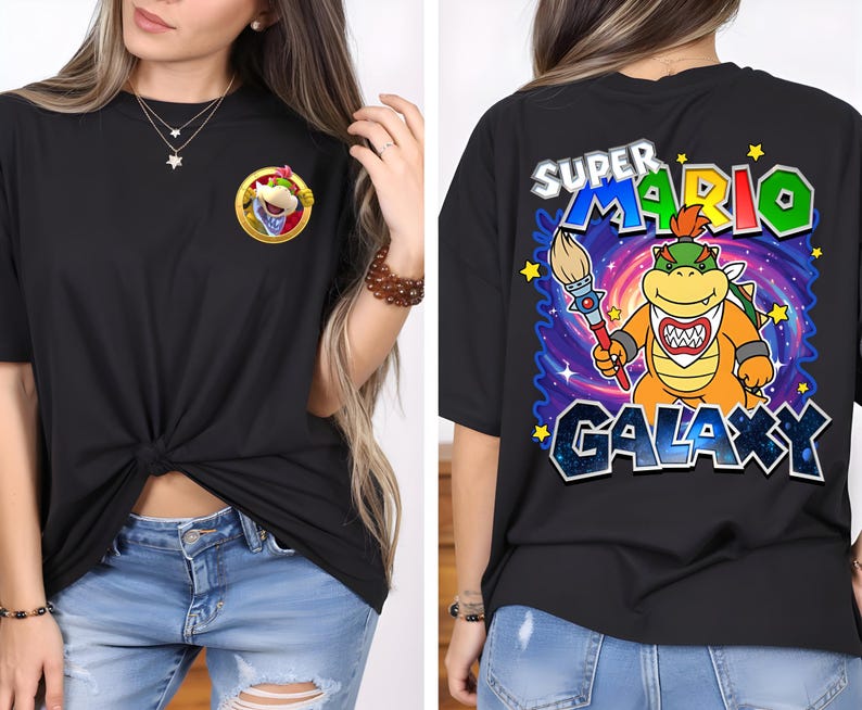 May include: Black t-shirt featuring a Bowser graphic on the front and back. The front graphic is a Bowser character in a gold frame. The back graphic says "Super Mario Galaxy" with a Bowser character holding a paintbrush.