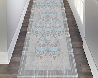 May include: A grey and blue patterned runner rug with a plaid border. The rug has a damask design with a light blue and white pattern.