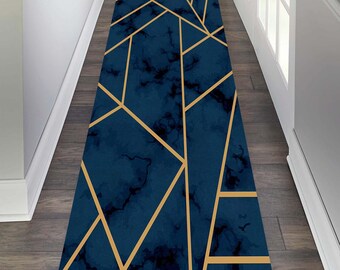 May include: A blue and gold geometric runner rug with a marble pattern. The rug has a modern design with gold lines on a blue background.