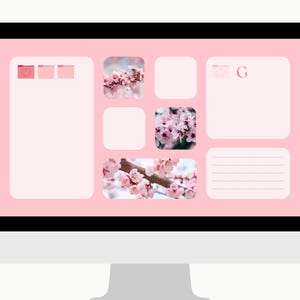 May include: A computer monitor displays a pink desktop organizer with a floral theme. The screen features a light pink background with various app icons and images of cherry blossoms. The overall aesthetic is soft and feminine.