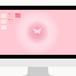 May include: A computer monitor displaying a pink desktop background with a butterfly graphic in the center. The screen features several pink folder icons and a star icon in the upper left corner. The monitor has a black bezel and a silver stand.
