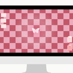 May include: A desktop computer with a black screen border and a white base. The screen displays a pink and red checkered pattern with a white butterfly in the center. Several icons are visible.