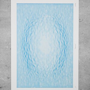 May include: A blue and white abstract print with a circular pattern. The print is titled "Nexus" and numbered 5/4.